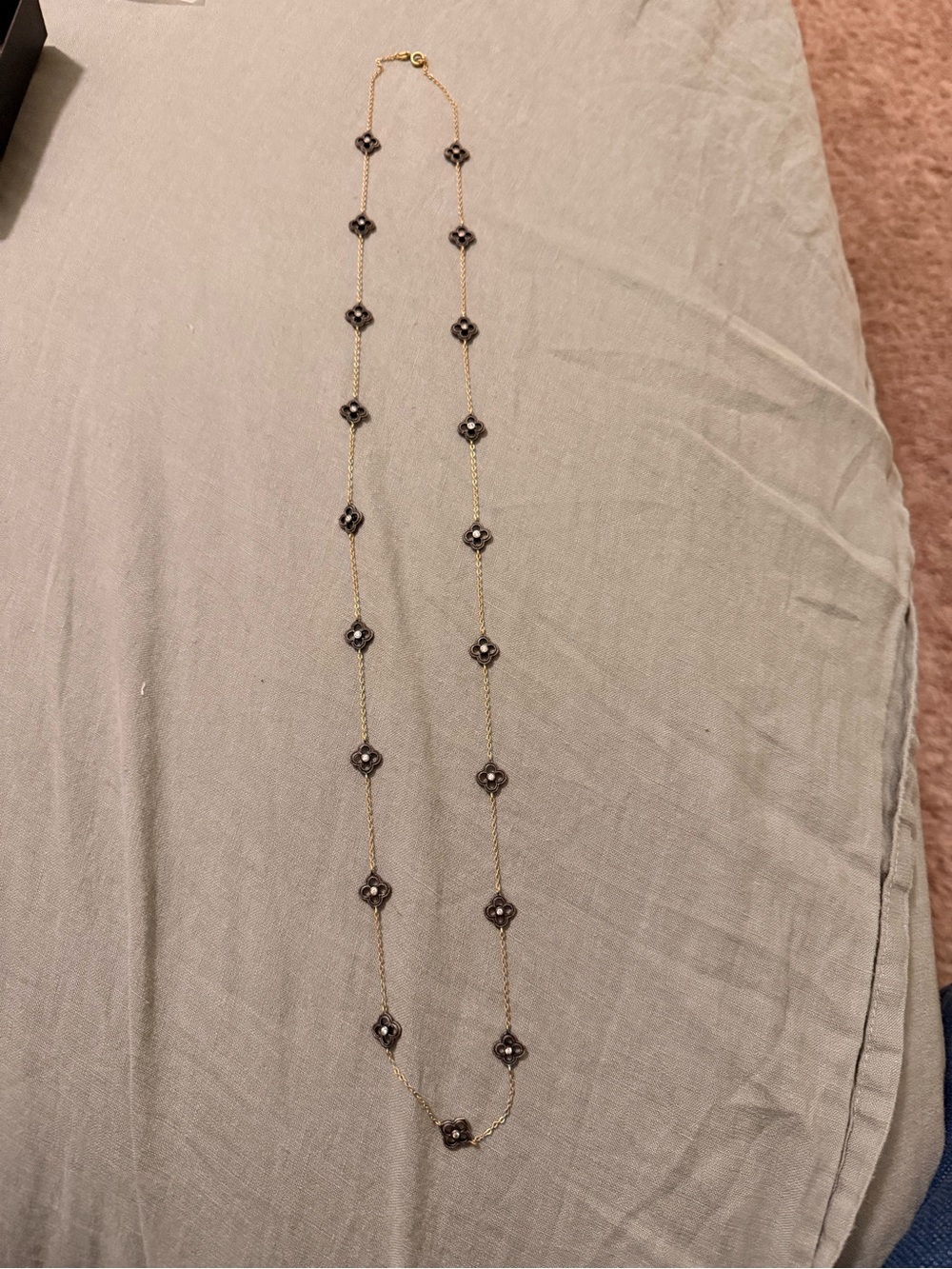 Gold Long Station Necklace with Black Flower Accents